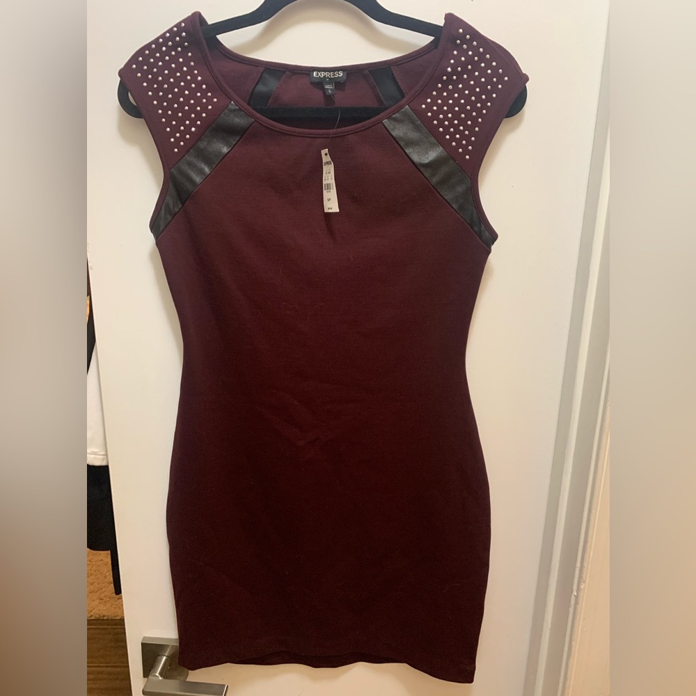 Who doesn’t love wine. Wine mini dress, cap sleeves, leather and stone accents.